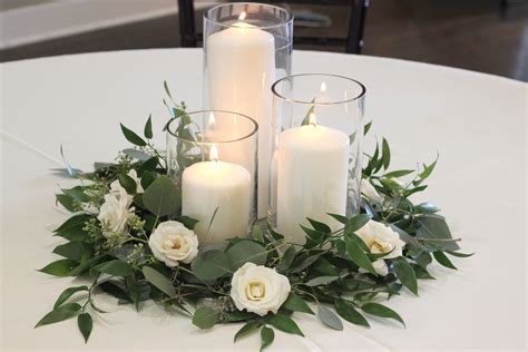  Pillar candle holders can enhance taller arrangements. 3. Generously place wedding votive candle holders. Wedding votive candle holders are one of the safest ways to add light to your reception tables. Both the wax and flame are contained to avoid any accidents. Plus, you can use the votive candles to add ambiance to your home post-wedding. 